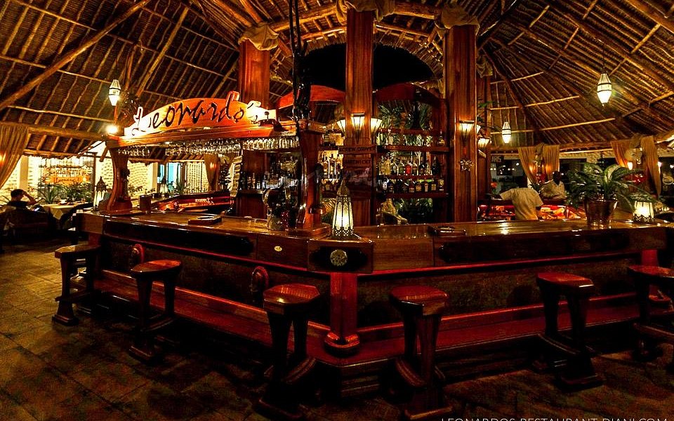 Dining under palm-thatched roof at Leonardo's